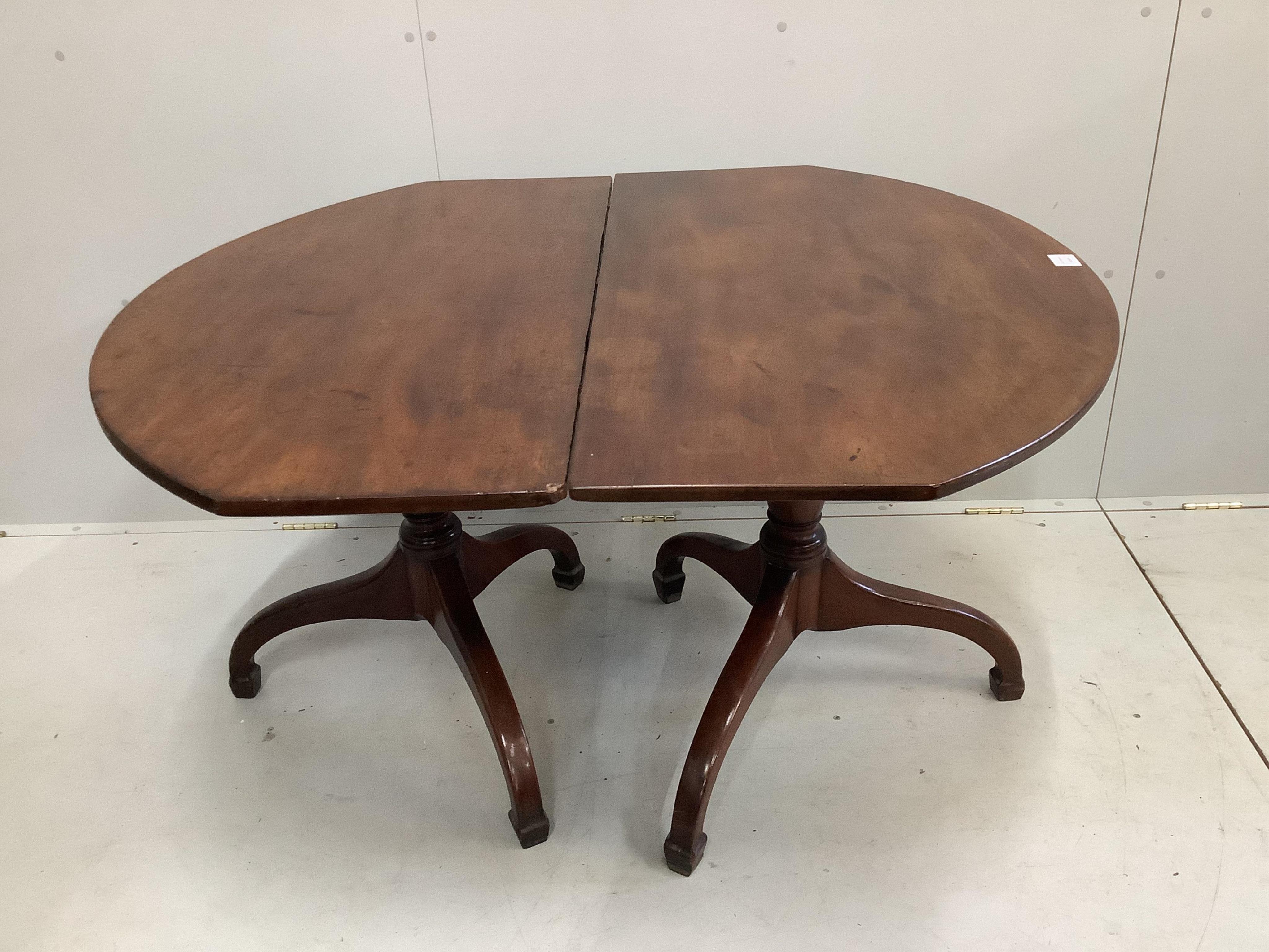 A George III mahogany two pillar dining table, no spare leaf, width 206cm, depth 59cm, height 70cm. Condition - fair